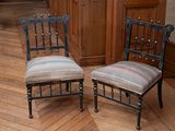 two chairs sitting next to each other on a hard wood floor