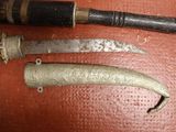 a knife and a knife holder sitting on a table