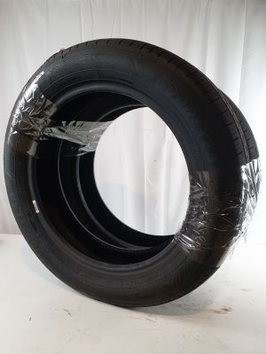 a tire that is sitting on a white surface