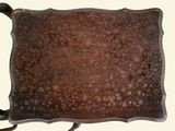 a brown tray with a handle and a handle on it