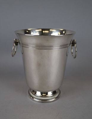an antique silver plated ice bucket with handles and handles