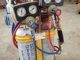 an image of a couple of air compressors sitting on top of a cart