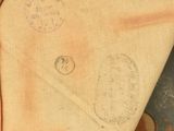 an old baseball glove with a baseball inside of it