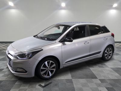 the white car is parked on a checkered floor in the garage