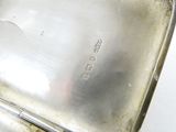 a silver plate that has a handle on it