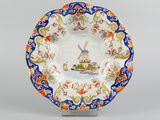 a close up of a plate with a boat on it