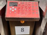 an image of a machine that has a clock on it