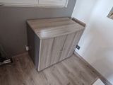 a small cabinet in the corner of a room