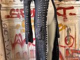 an image of a mannequin in front of a graffiti covered wall