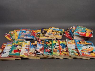 a lot of comic books that are on the table