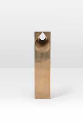a close up of a metal object on a white surface
