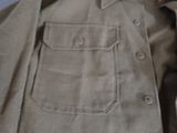 a close up of a shirt with buttons on it