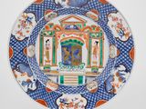 une image représentant une assiette bleue et blanche ornée d'une peinture