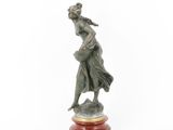 an image of a statue of a woman holding a baby