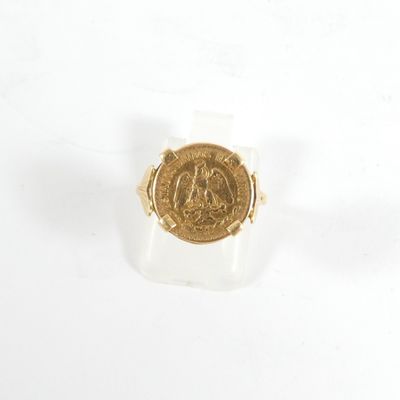 une image représentant une bague en or sur laquelle figure le portrait d'un homme