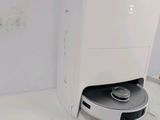 a machine that is sitting on the floor next to a wall
