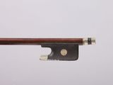 a close up of a violin bow on a white background