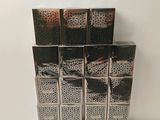 a stack of six boxes of cigarettes sitting on a table