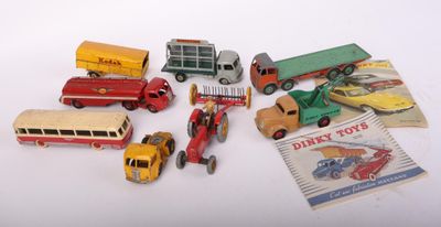 a lot of toy cars and trucks that are on a table