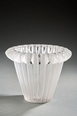 a white vase that is sitting on a table