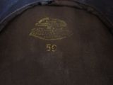 a close up of a brown jacket with a gold emblem