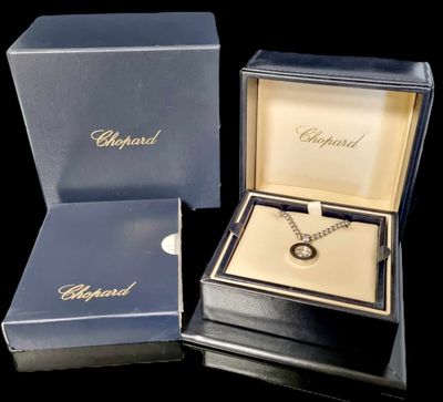 a box with a necklace in it and a box with a necklace in it