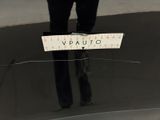 a person standing in a room with a sign on the floor