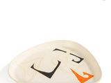 an image of a white plate with a black and orange design