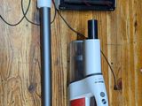 a picture of a vacuum and a vacuum cleaner on a wooden floor