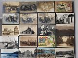 an old photo of a bunch of old photos hanging on a wall