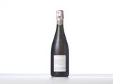 the bottle of champagne is sitting on the table