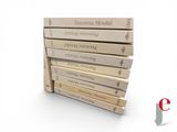 several books stacked on top of each other on a white surface