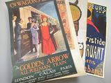 three posters on the wall of a train station