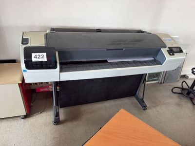 a large printer sitting on a table in a room