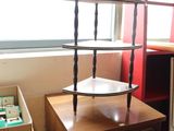 a wooden table with a shelf on top of it