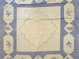 an image of a blue and white table cloth with a picture of a horse