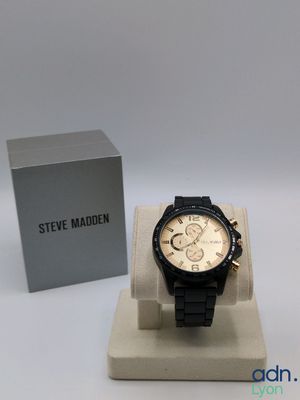 a watch that is sitting on a stand in front of a box