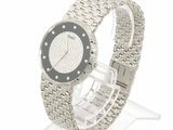 a watch that is sitting on a clear stand