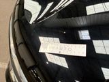 a sticker on the windshield of a car with a sign on it