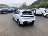 a lot of cars parked in a parking lot with mountains in the background