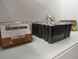 a lot of black bags on the counter in the store