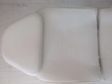 a close up of a white seat cushion on a motorcycle