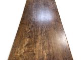 a close up of a wooden table top on a white background