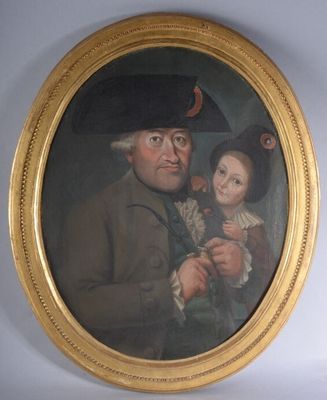 portrait d'un homme et d'un enfant dans un cadre doré