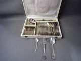 silverware in a case with spoons, forks and spoons in it