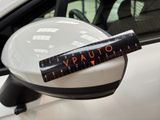 a sticker on the side view mirror of a car