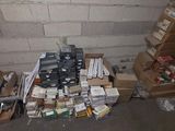 a pile of electronic equipment sitting on the floor in a room