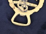 a bottle opener that has a picture of a bird on it