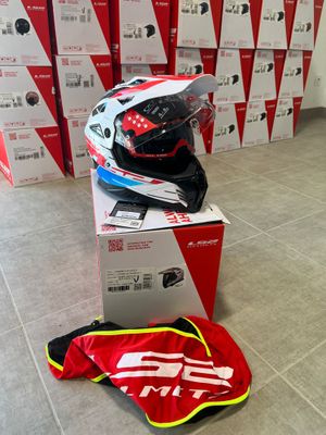 a box with a helmet on top of it next to a bag