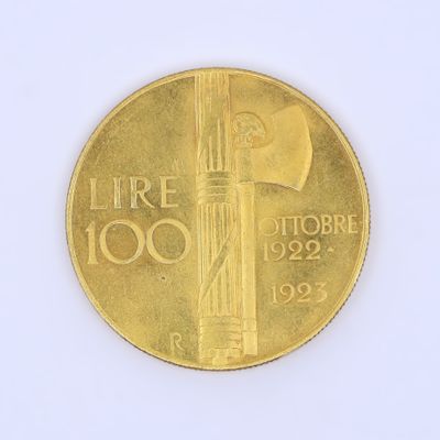une pièce d'or sur laquelle est représenté un phare